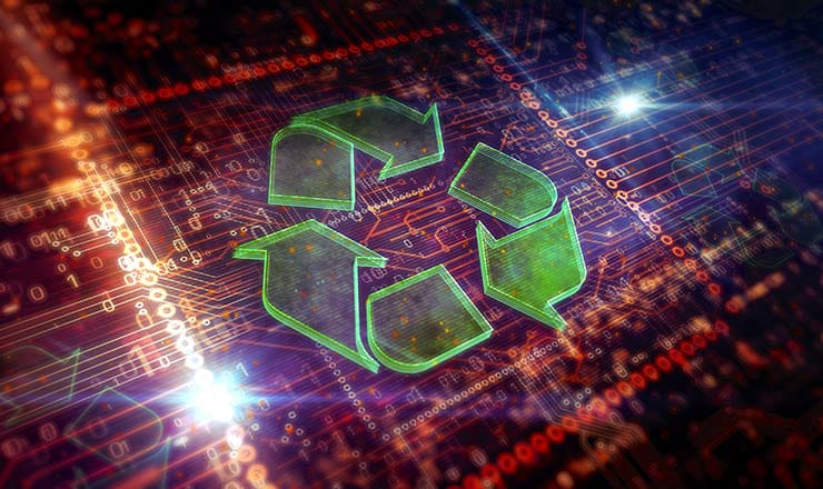 Green recycling logo is overlayed on an illuminated computer motherboard in the background