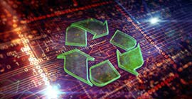 Green recycling logo is overlayed on an illuminated computer motherboard in the background