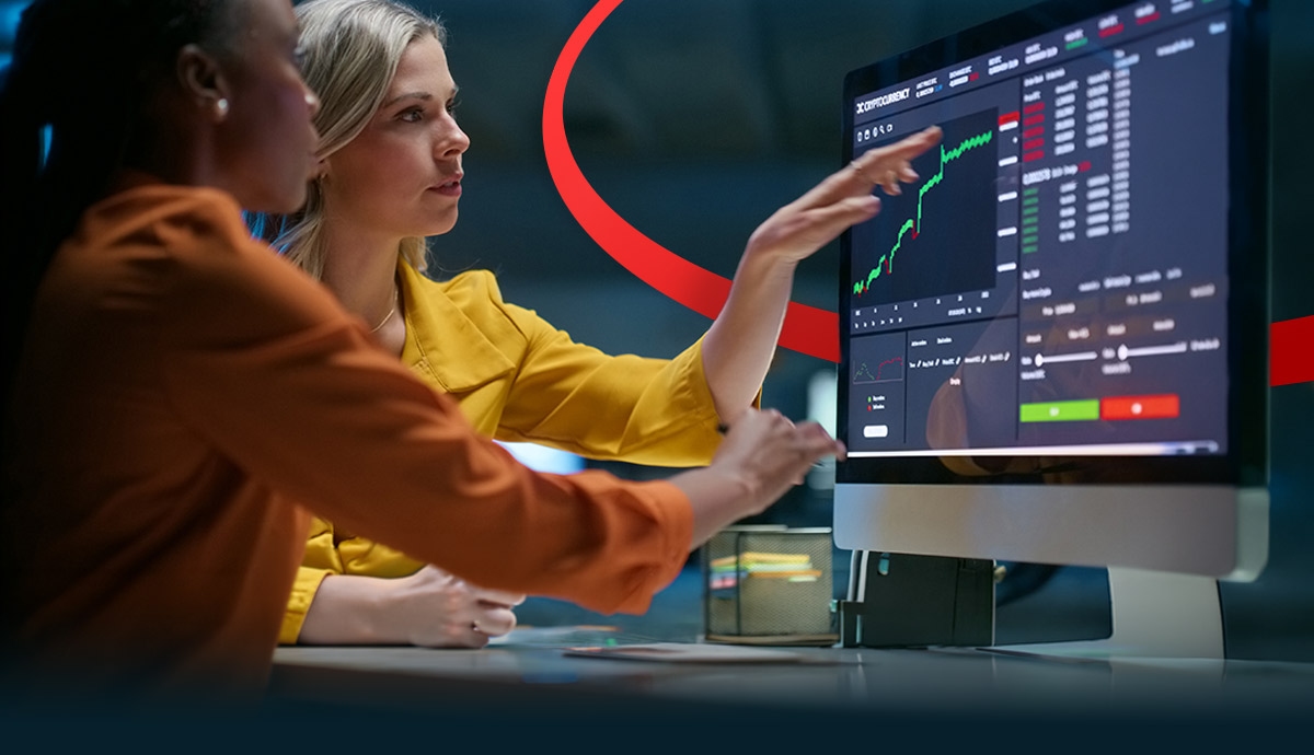IT professionals reviewing real-time analytics dashboards on a workstation to manage secure and efficient edge computing environments