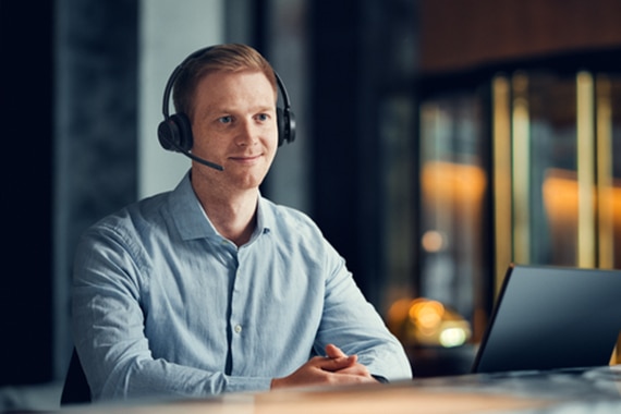 image of a man wearing a headset inside an office