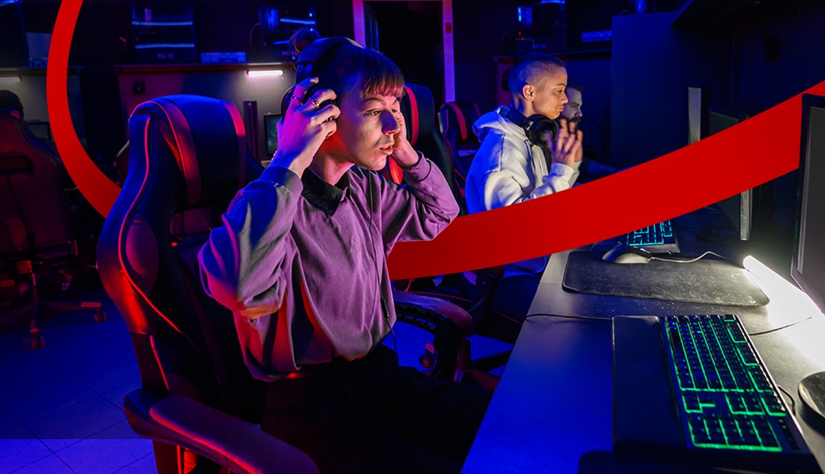 Students competing at school in an esports gaming room.