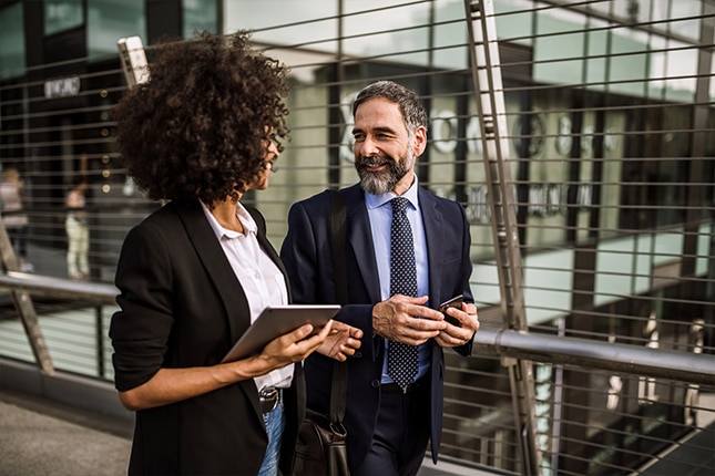 Businesswoman using digital tablet outdoors