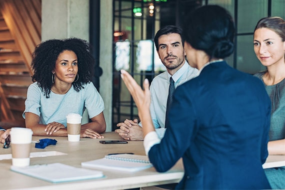 Multi-ethnic group of business persons discussing business