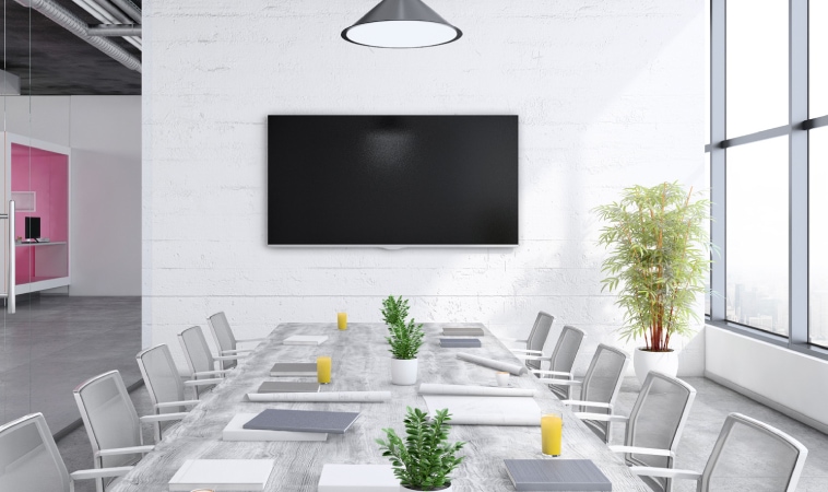 Image of an empty meeting room with Microsoft teams room setup.