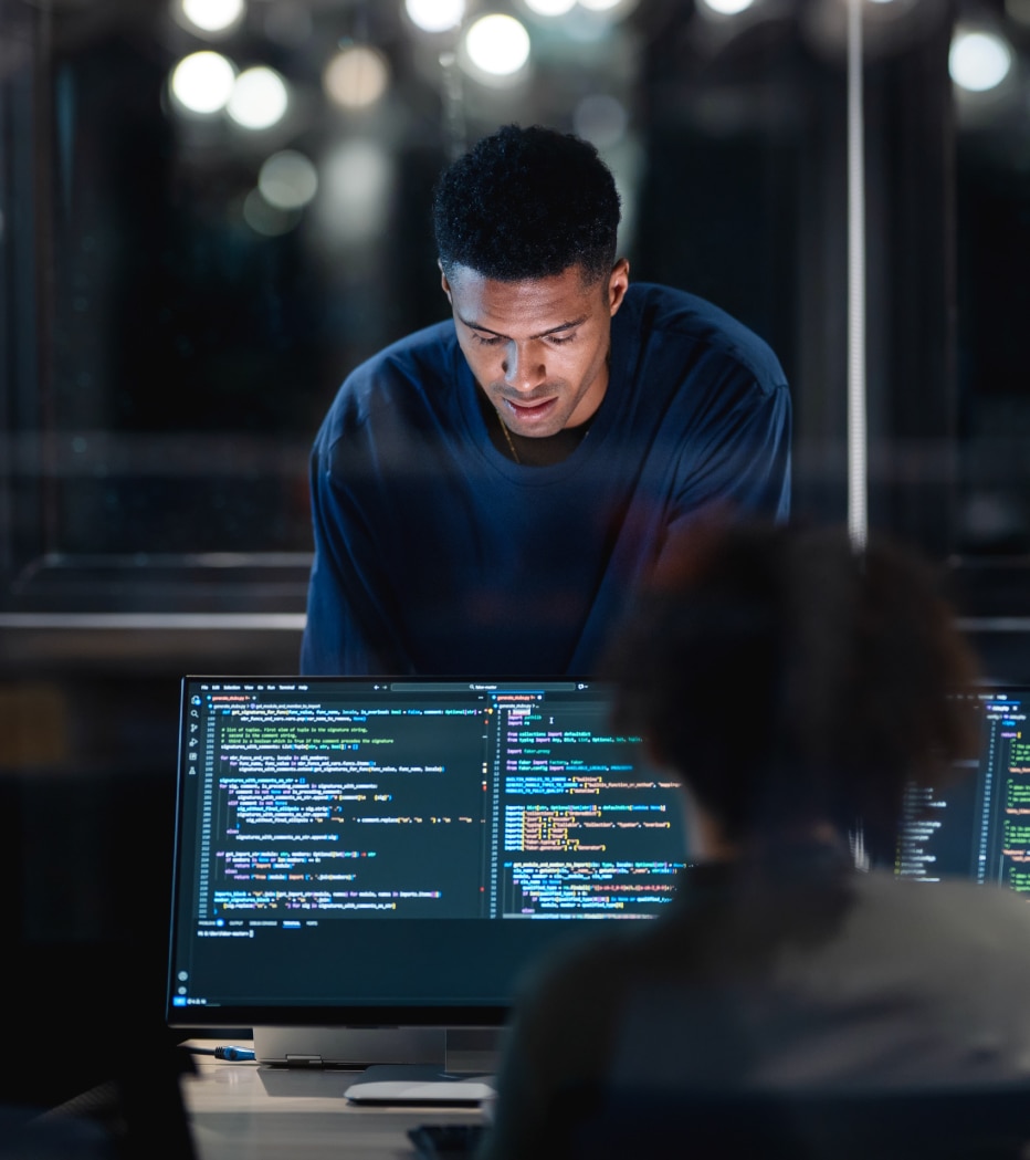 IT professional managing cloud environments across multiple monitors