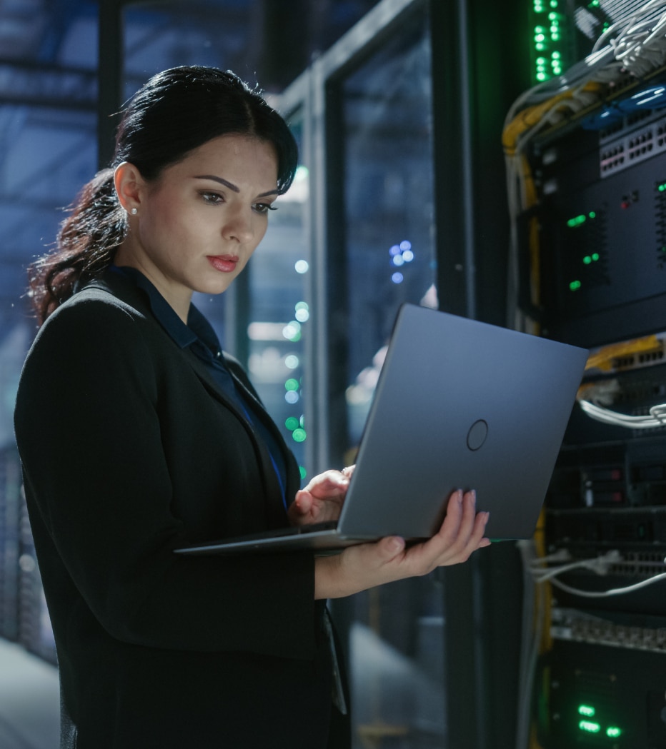 Cybersecurity specialist monitoring systems in a data centre