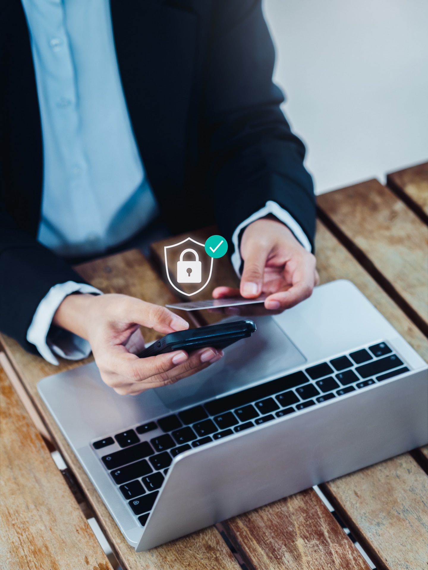 Person using multifactor authentication on a phone to sign in on a laptop