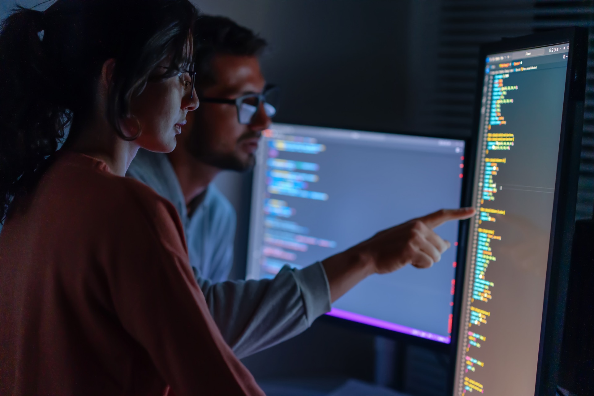 People looking at computer screen.