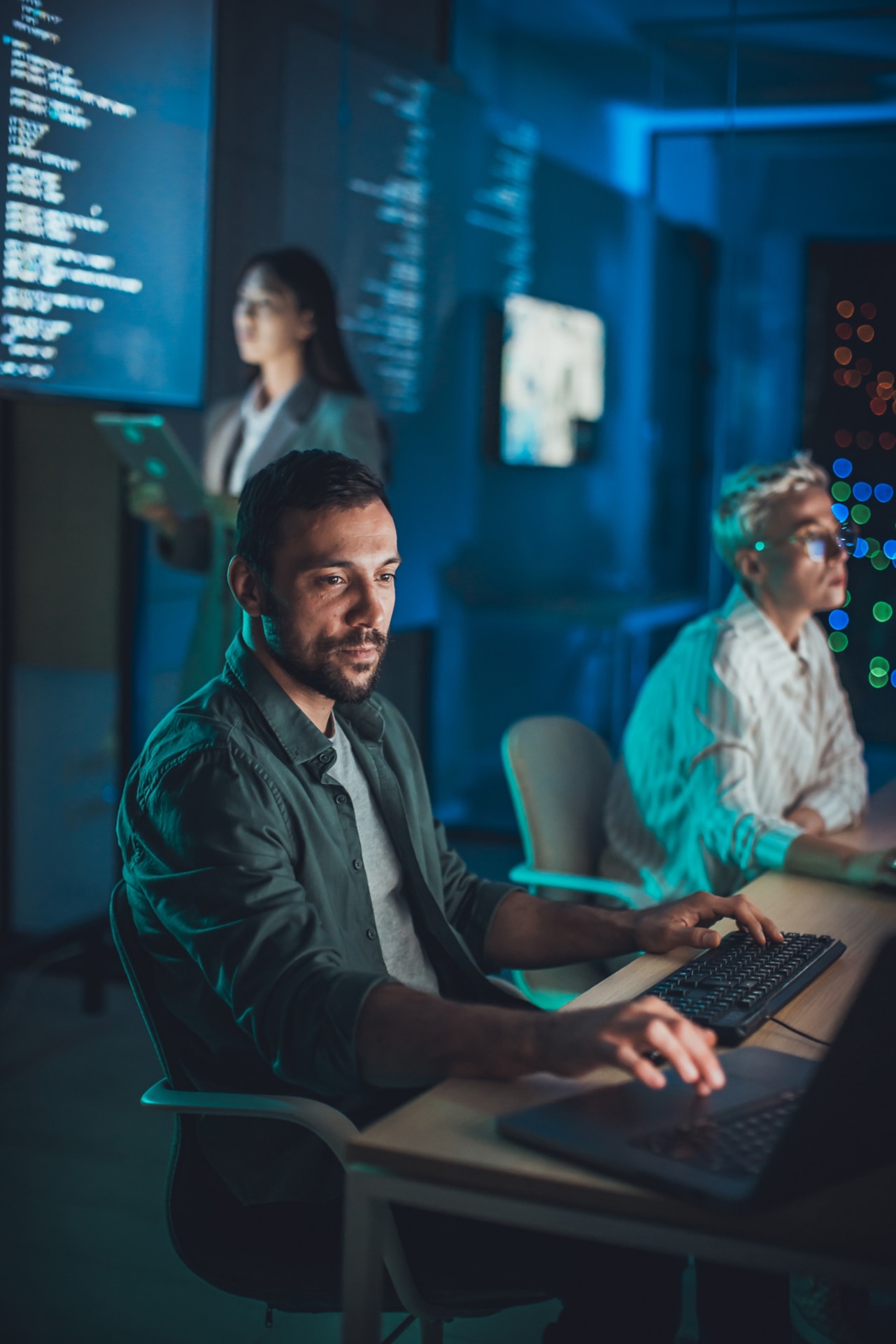 Security operations centre team monitoring systems during incident response