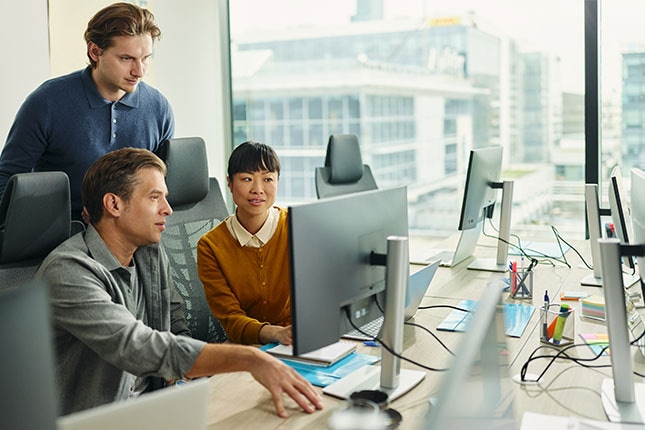 Team collaborating in a modern office environment, demonstrating how enabling connectors with Agentspace unlocks seamless productivity and integration.