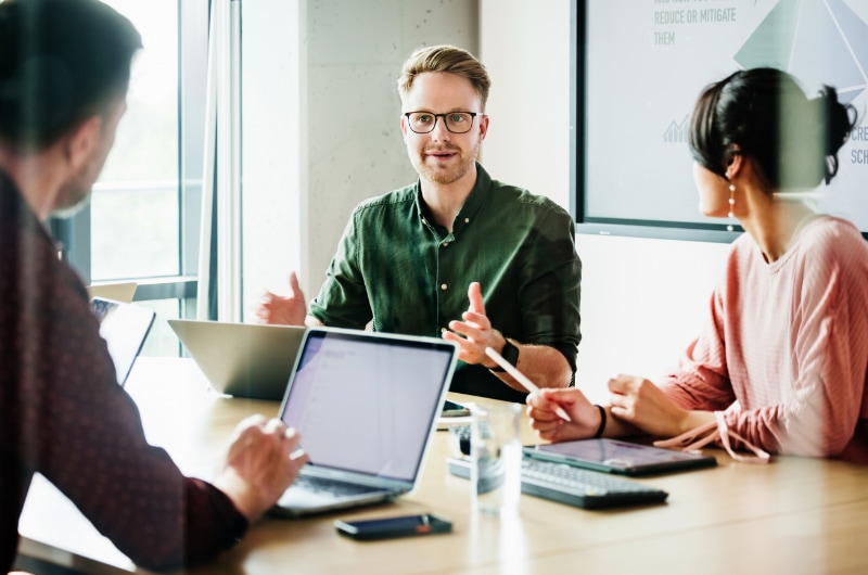 IT team discussing digital transformation strategy in a meeting room.