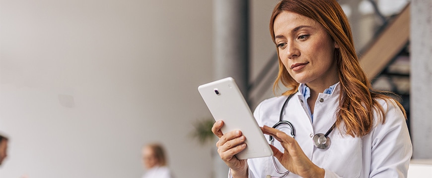 Woman in the healthcare industry on table reviewing documents