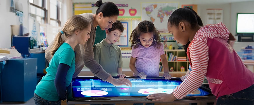 Teacher and students using digital tablet 