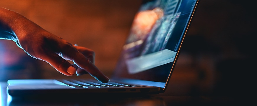 hand typing on computer keyboard