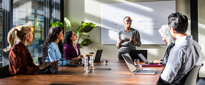 Human hand touching holographic AI-related technology graphics.