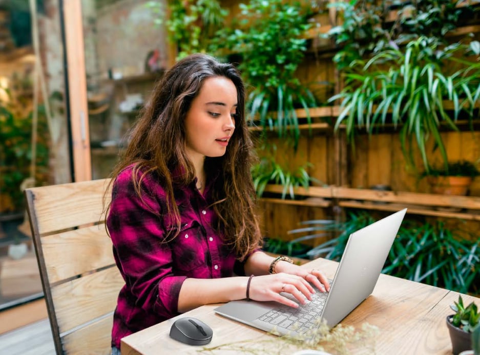 Lady working on her dell laptop.