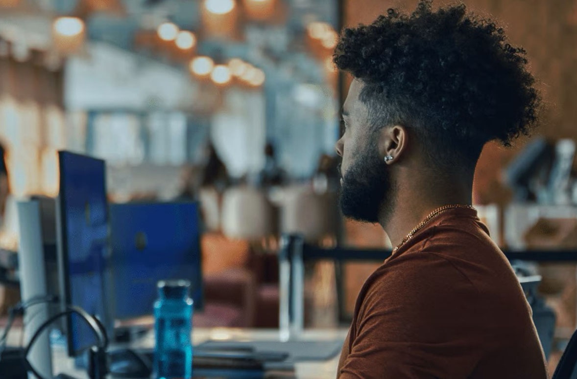 people working on desktop computers
