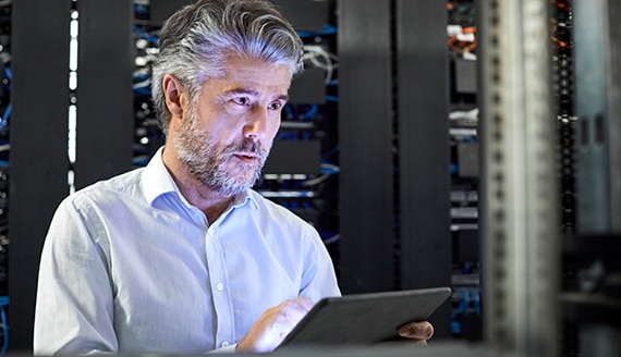 thumbnail image of an IT specialist working in a server room