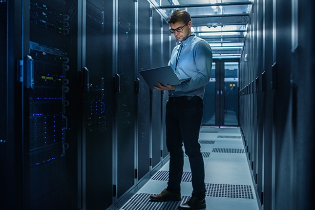 thumbnail image of an IT specialist working inside a data center