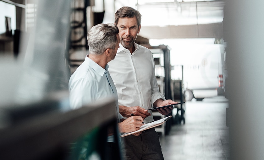 image of two data center employees inside a warehouse