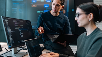 Engineers working on code.