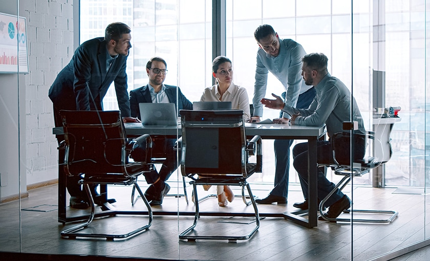 image of finance workers inside a clear glass office space