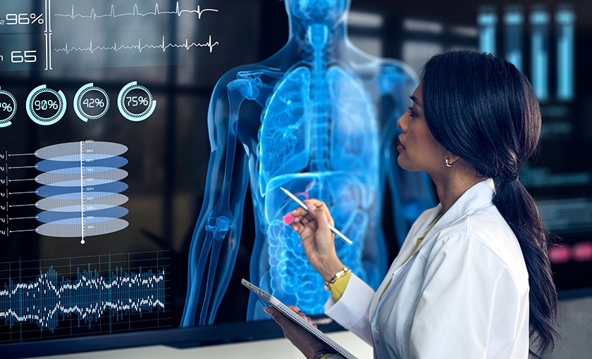 image of a healthcare worker reviewing data on an interactive display