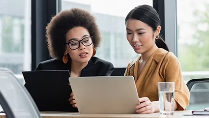 Coworkers using Intel laptops.