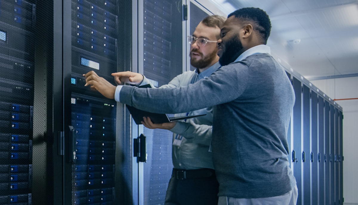 banner image of two IT specialists working in a data center