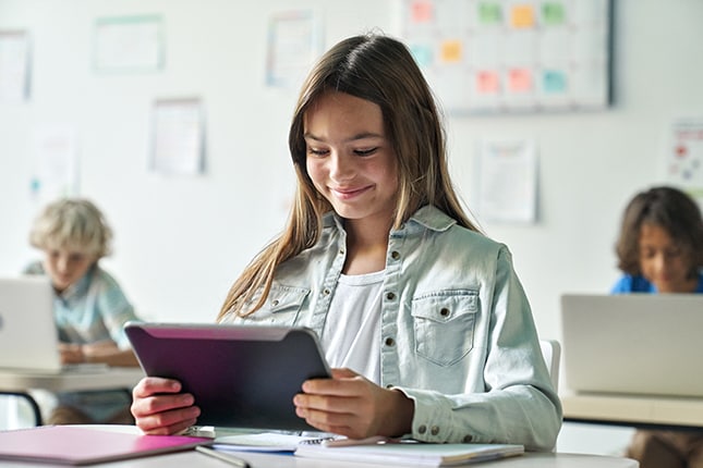 Grade school student working on new tablet.