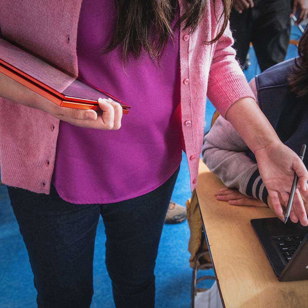 Young students are using laptops in the classroom.