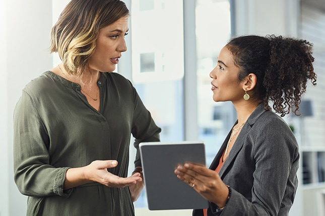 Coworkers discussing CDW managed hybrid cloud