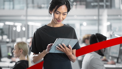 Young woman using tablet in office.