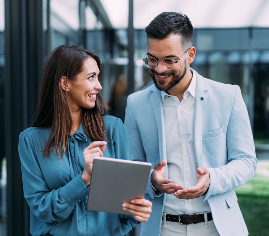 Two business people working on a tablet