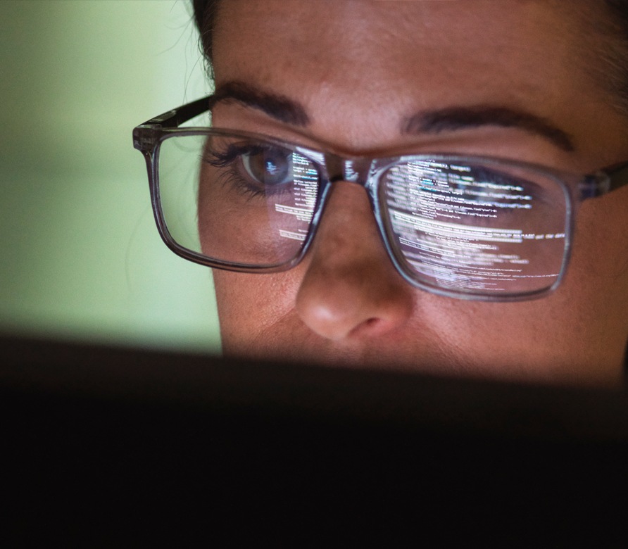 A person looking at a laptop screen