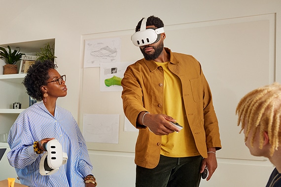 image of a man wearing Meta VR headset inside an office around coworkers