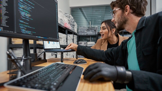 image of IT employees working on cloud solutions on a laptop computer