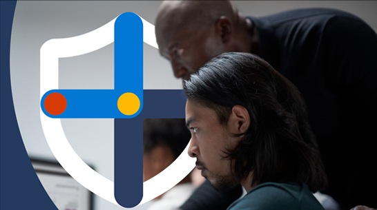 banner image for Microsoft Defender XDR of two workers in front of a computer