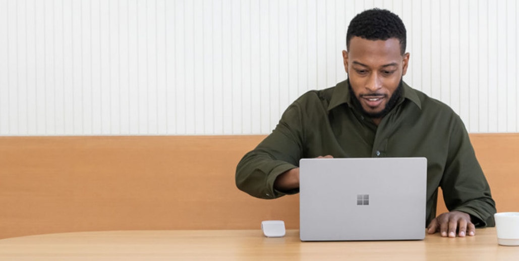 Person sitting and using a surface device