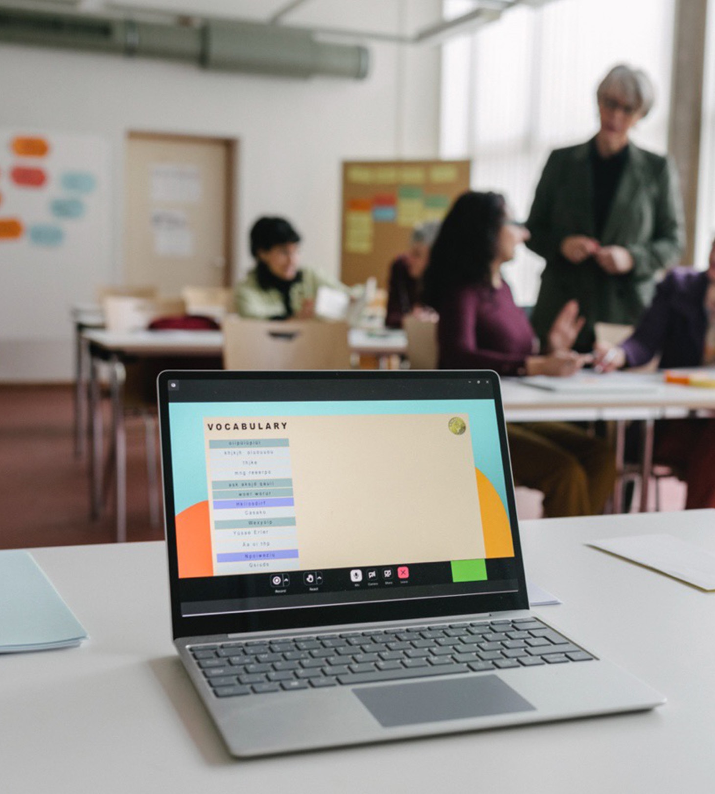 Young students are using laptops in the classroom.
