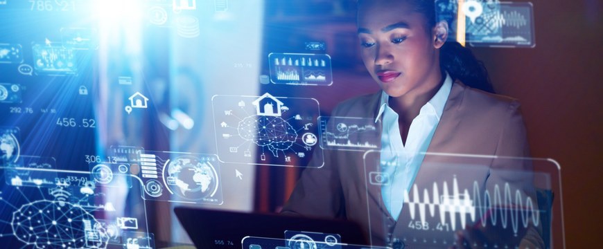 Professional working at laptop with floating AI analytics dashboards and data visualizations
