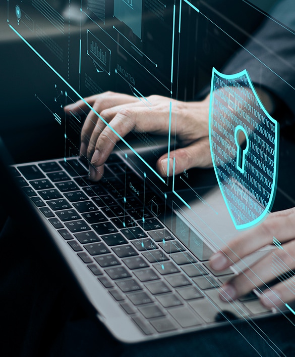 Close up image of hands typing on keyboard.