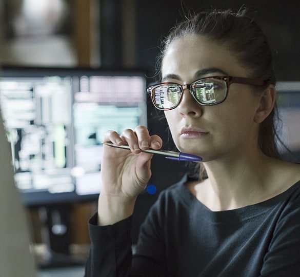 Woman looking at computer screen.