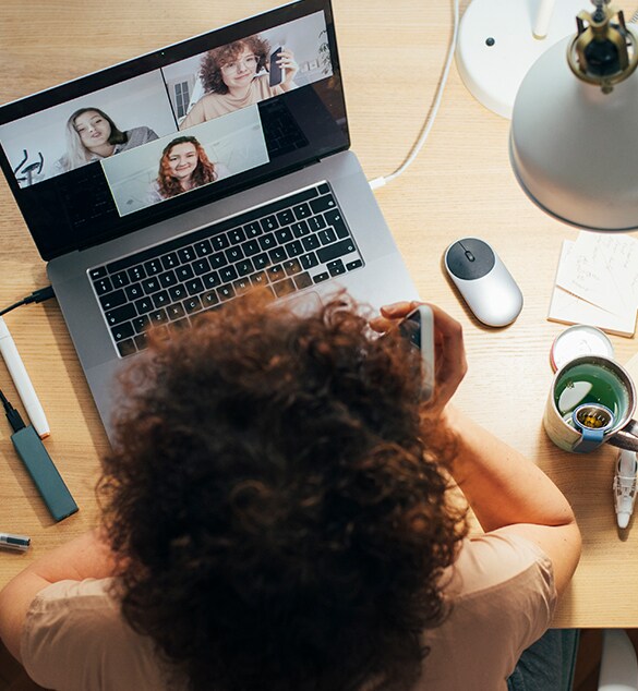 Image of woman attending a video conference on her laptop.