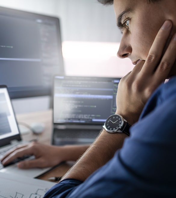 Image of man working on a computer.