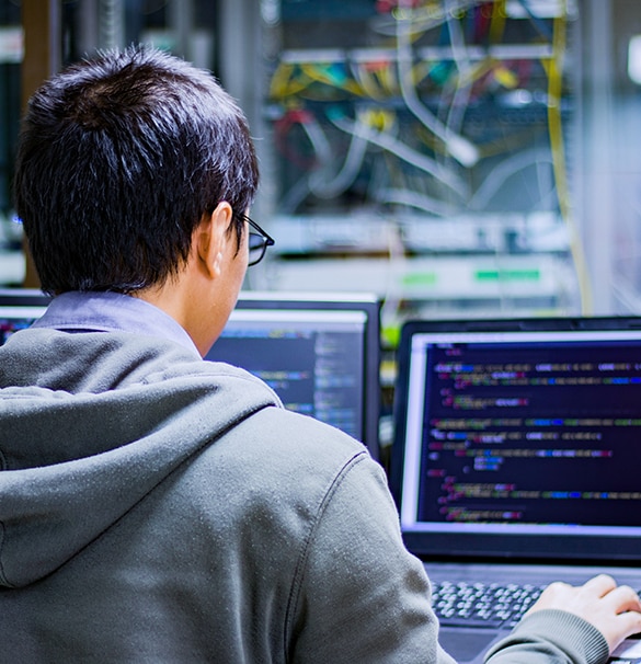 Image of man using laptop computer.