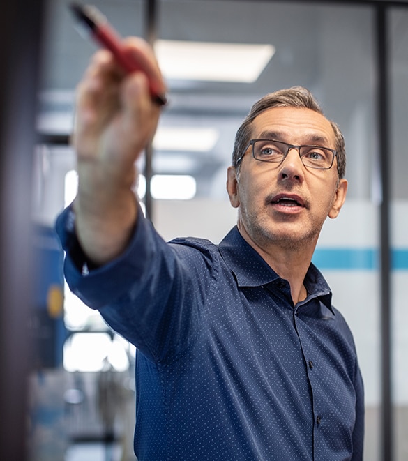 Man pointing at a digital whiteboard.