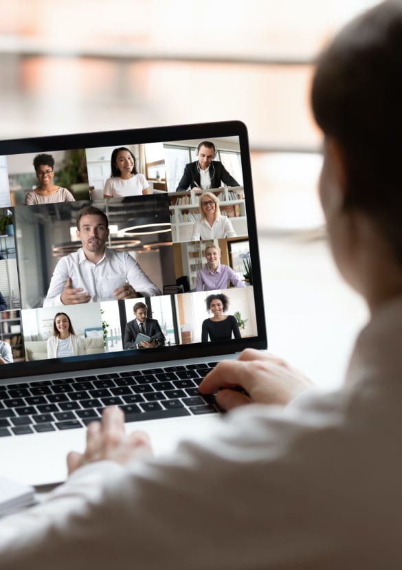 Close up image of a man facilitating an online focus group on a laptop.