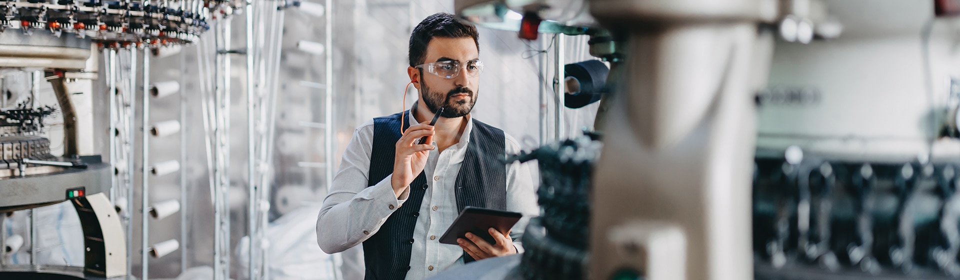 Person logging into a laptop with a aerial projection of the lock screen as an abstract.