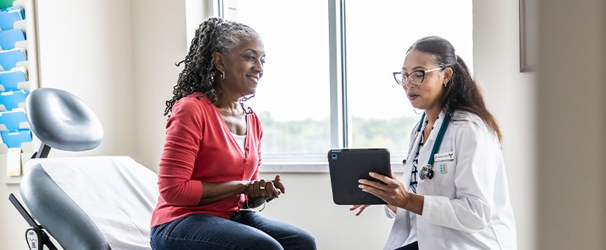 hospital clinicians using digital technology with patients